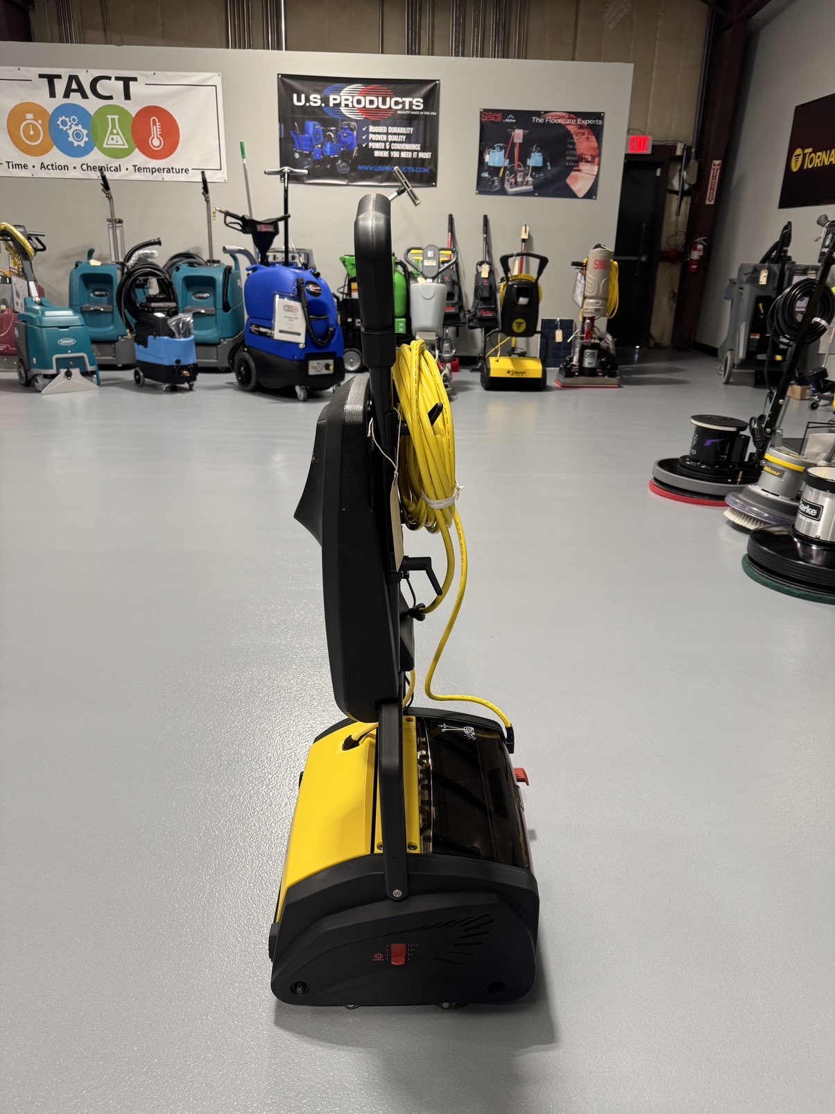 A Tornado Vortex 13 Cylindrical Floor Scrubber in a warehouse showroom at ChemSource Direct.
