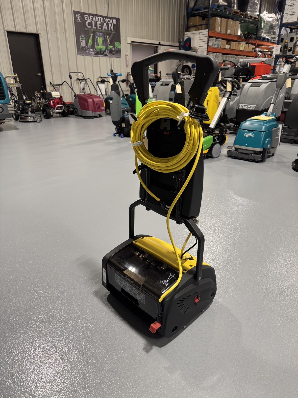 A Tornado Vortex 13 Cylindrical Floor Scrubber in a warehouse showroom at ChemSource Direct.