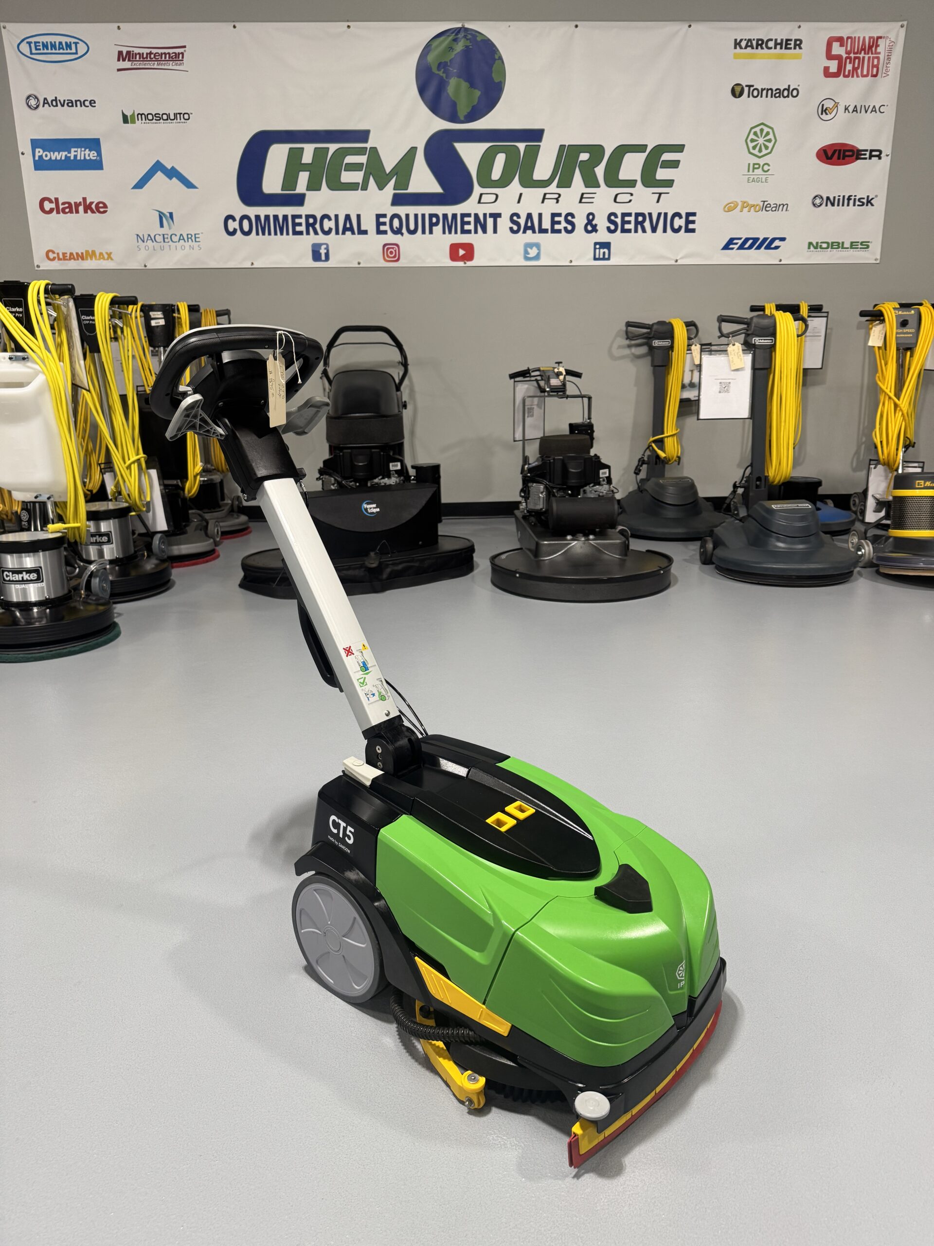 An IPC CT-5 Mini Floor Scrubber in a warehouse showroom at ChemSource Direct.