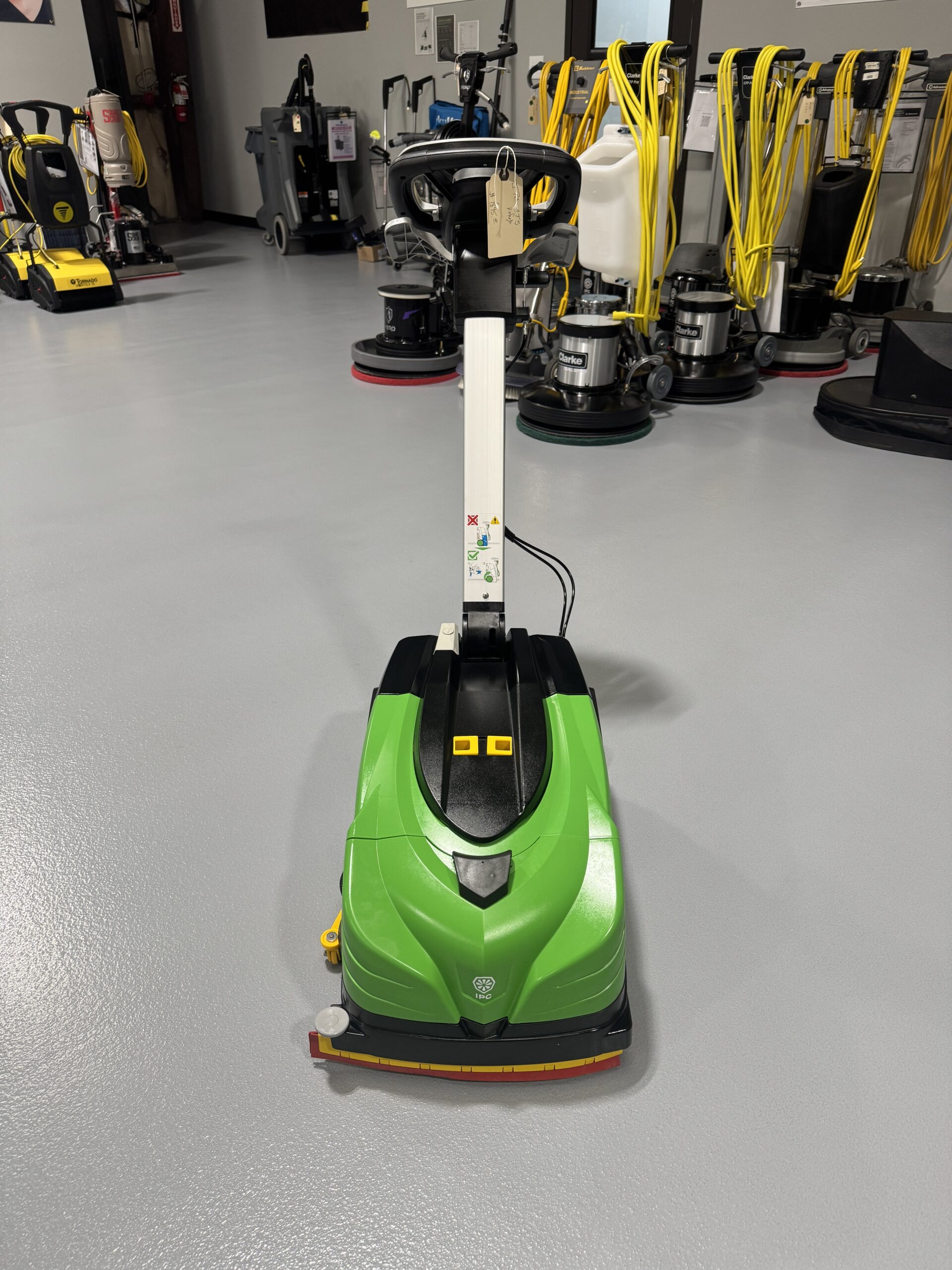 An IPC CT-5 Mini Floor Scrubber in a warehouse showroom at ChemSource Direct.