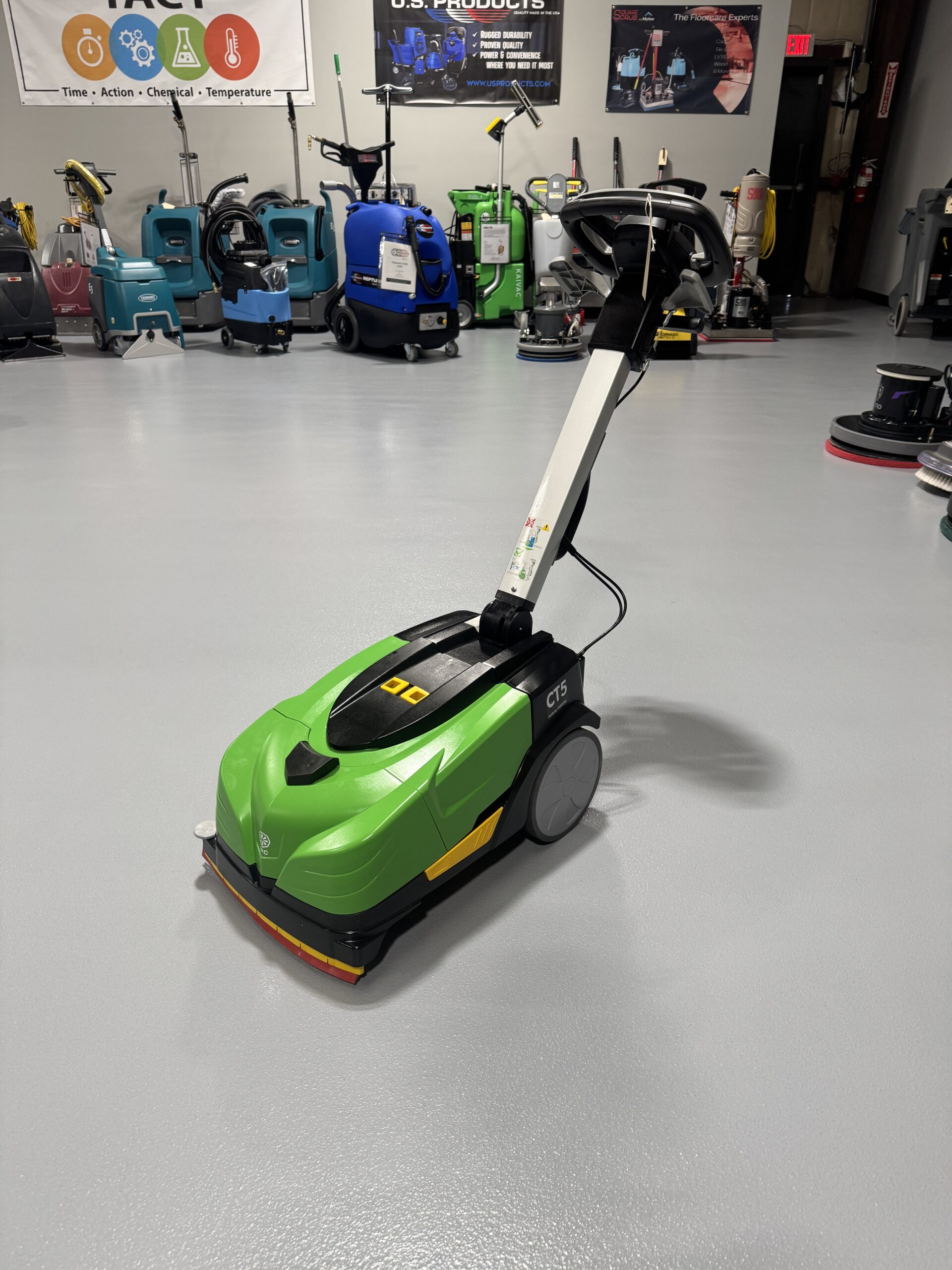 An IPC CT-5 Mini Floor Scrubber in a warehouse showroom at ChemSource Direct.