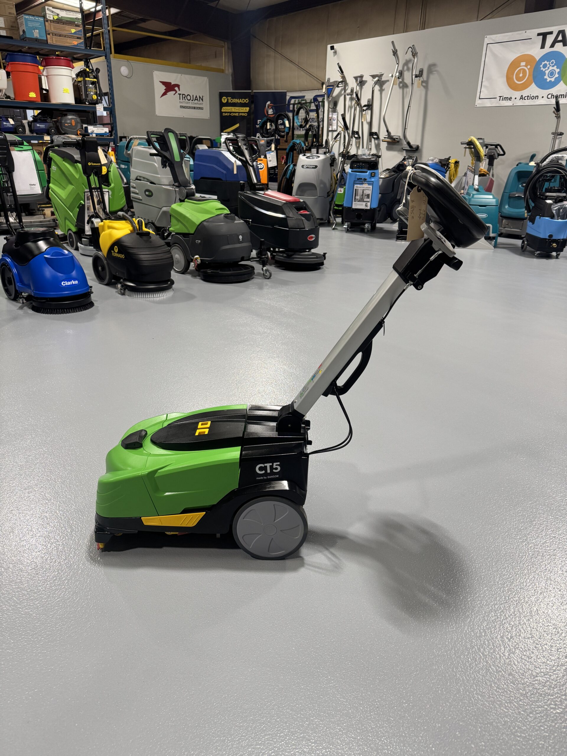 An IPC CT-5 Mini Floor Scrubber in a warehouse showroom at ChemSource Direct.