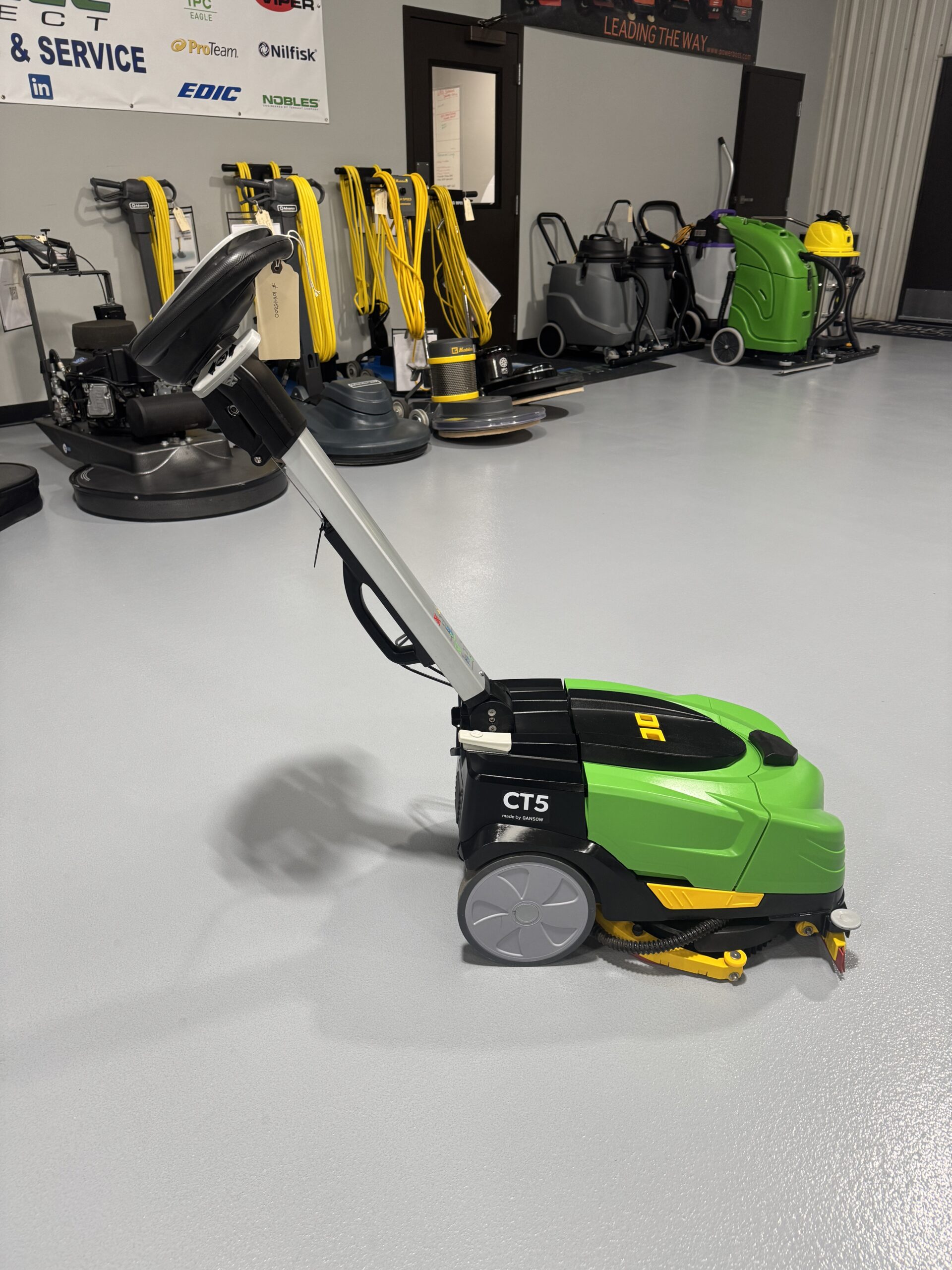 An IPC CT-5 Mini Floor Scrubber in a warehouse showroom at ChemSource Direct.