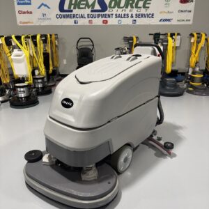 An Onyx DX32T Walk-Behind Scrubber in a warehouse showroom at ChemSource Direct.