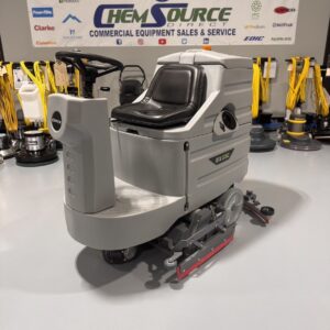 An Onyx RX30C Cylindrical Ride-On Scrubber in a warehouse showroom at ChemSource Direct.