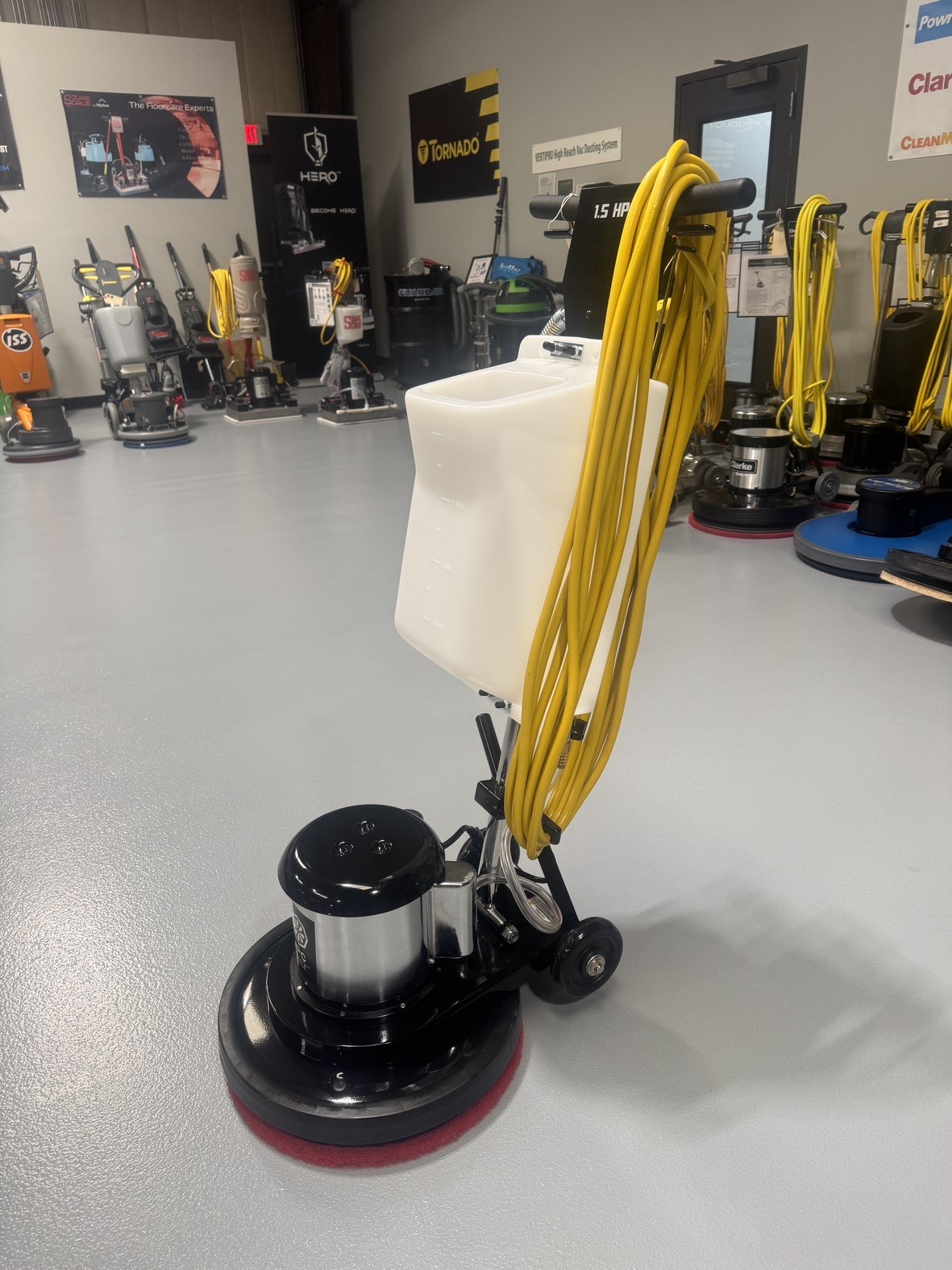 An IPC FM17 HD Low Speed Scrubber with Tank in a warehouse showroom at ChemSource Direct.