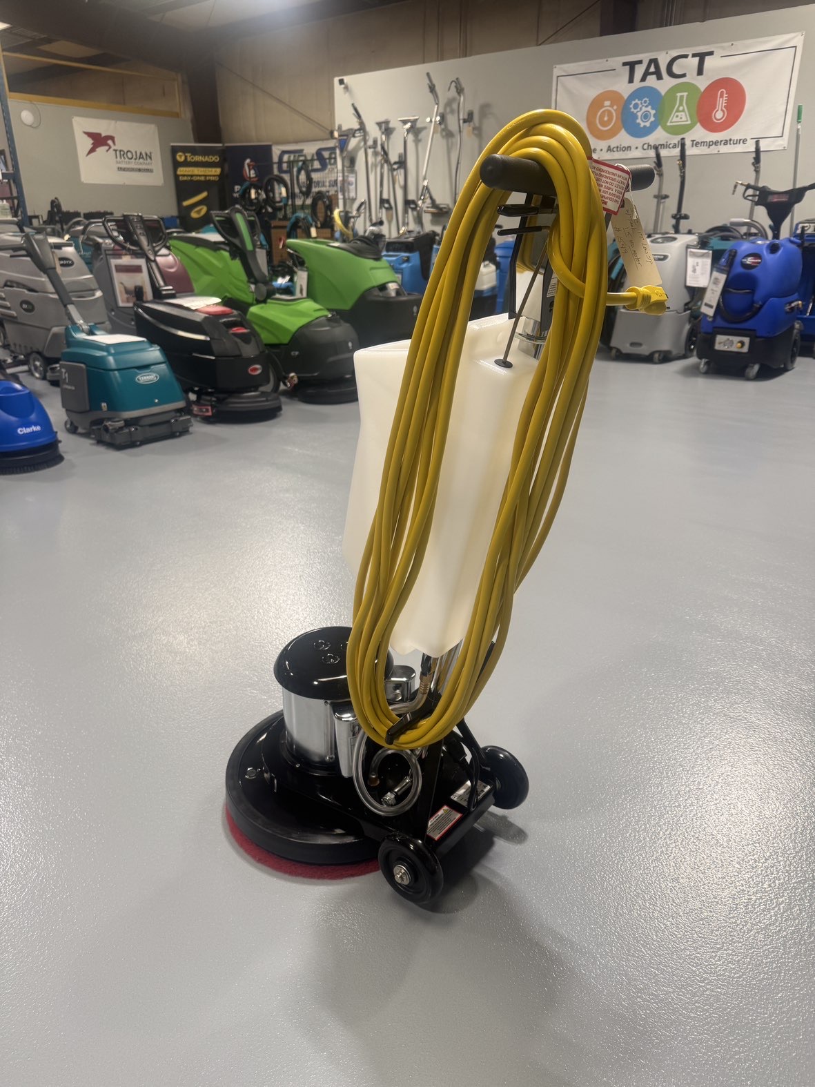 An IPC FM17 HD Low Speed Scrubber with Tank in a warehouse showroom at ChemSource Direct.