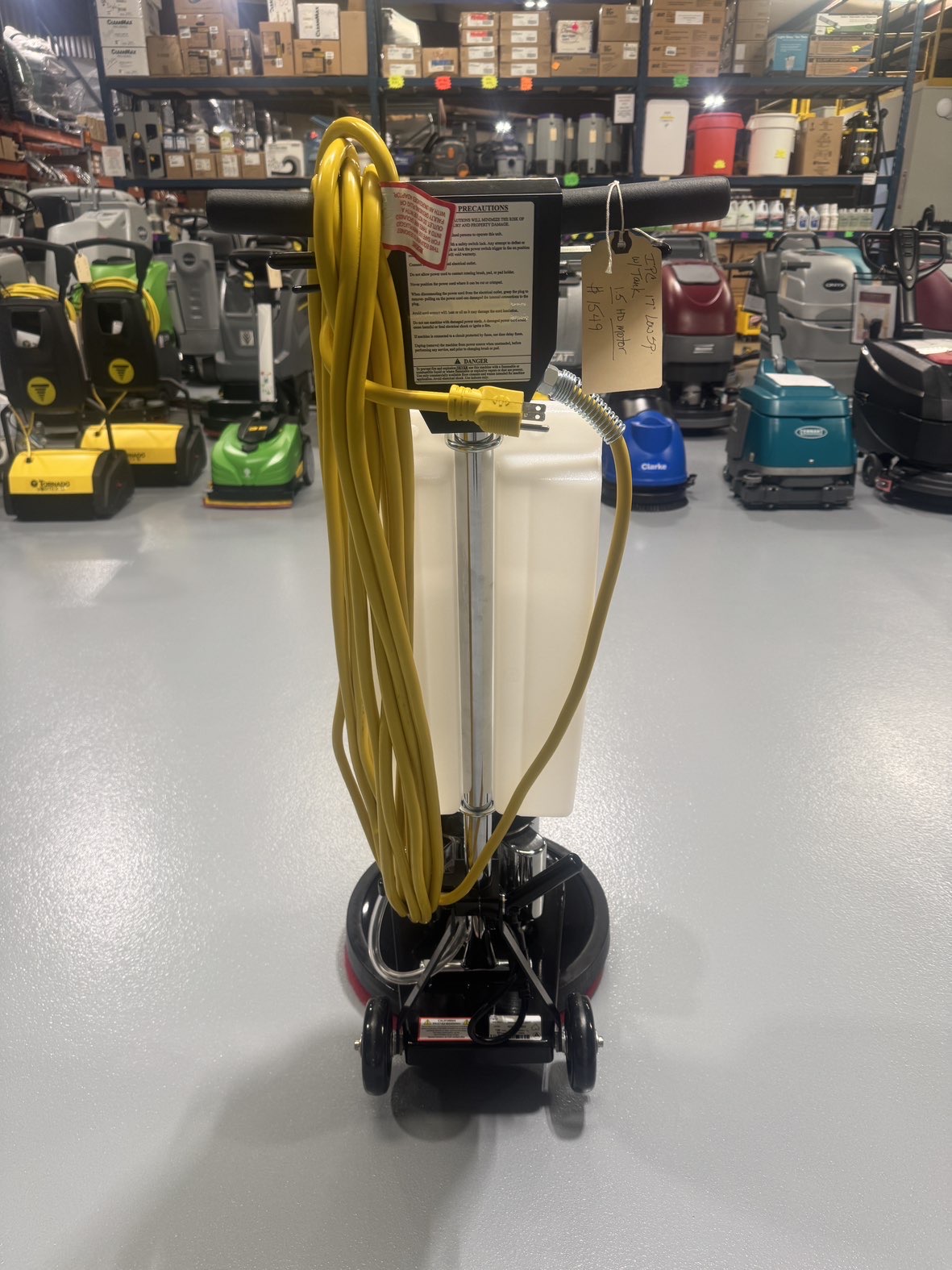 An IPC FM17 HD Low Speed Scrubber with Tank in a warehouse showroom at ChemSource Direct.