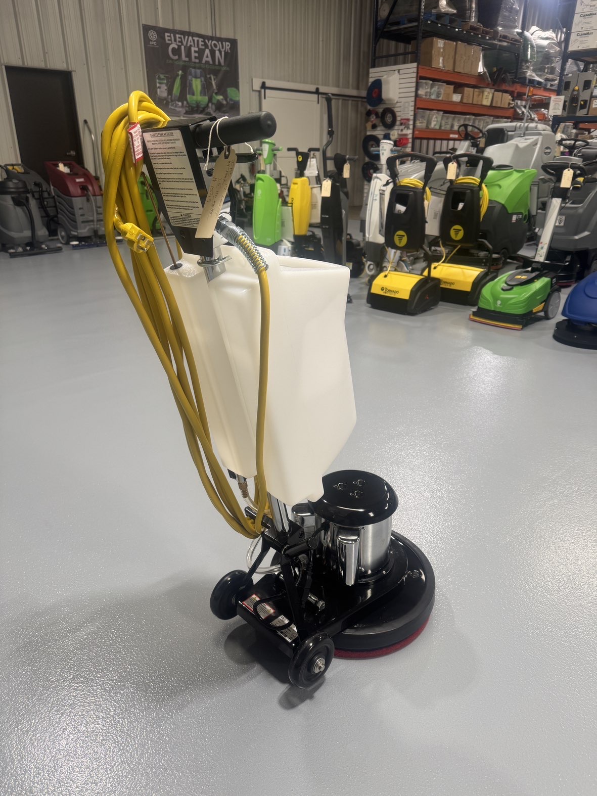 An IPC FM17 HD Low Speed Scrubber with Tank in a warehouse showroom at ChemSource Direct.