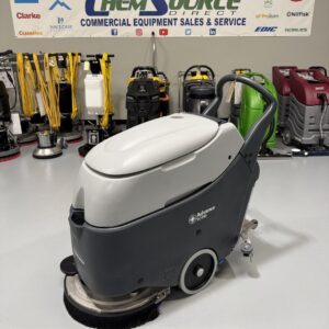 An Advance SC450 Walk-Behind Scrubber in a warehouse showroom at ChemSource Direct.